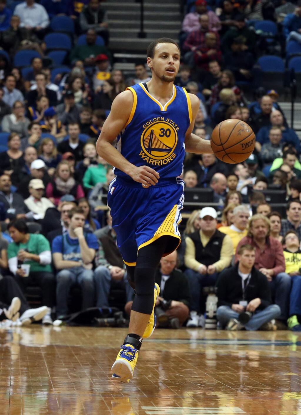 Golden State Warriors' Stephen Curry plays in the second half of an NBA basketball game against the Minnesota Timberwolves, Wednesday, Feb. 11, 2015, in Minneapolis. The Warriors won 94-91. (AP Photo/Jim Mone)