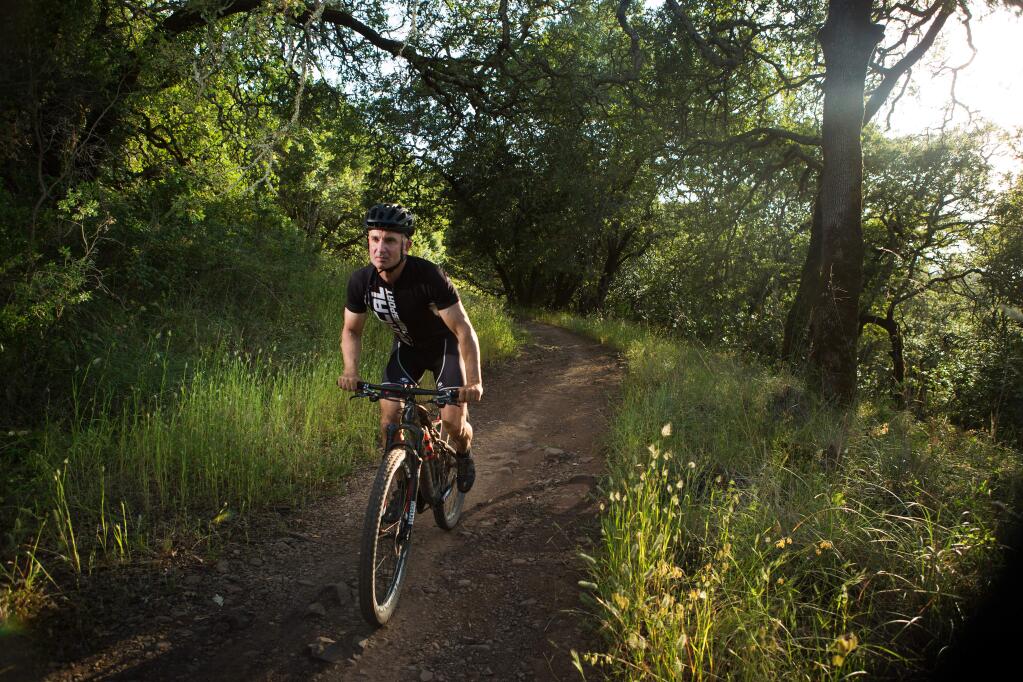 Torah Soltani, owner of Mac's Deli, rides Marsh Trail in Annadel State Park Friday Evening. Shot on Friday, May 27, 2016 in Annadel State Park near Santa Rosa, California. ( Photo by Charlie Gesell for the Press Democrat)