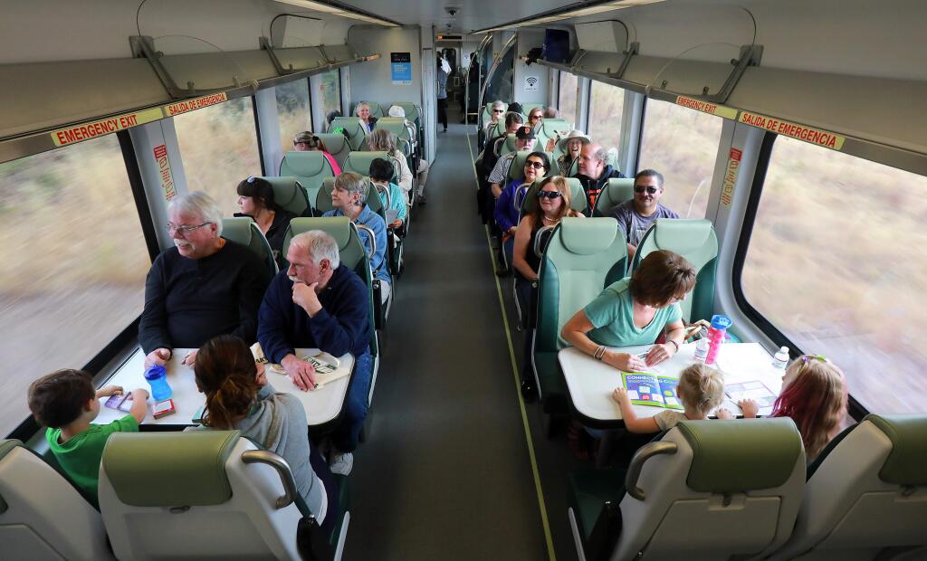 Train lovers, commuters and those just interested in the scenery rode the SMART train for free between Rohnert Park and San Rafael on Thursday morning, June 29, 2017. (John Burgess/The Press Democrat)