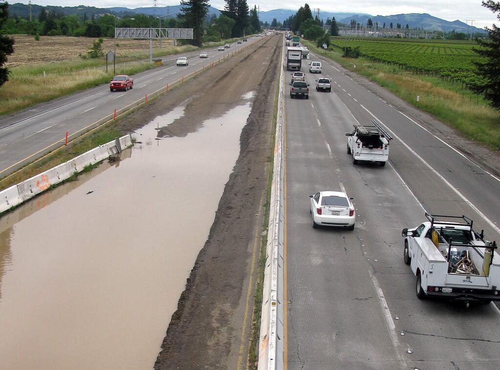 Highway 101 looking south from thee Fulton Road overcrossing shows the flooded median.