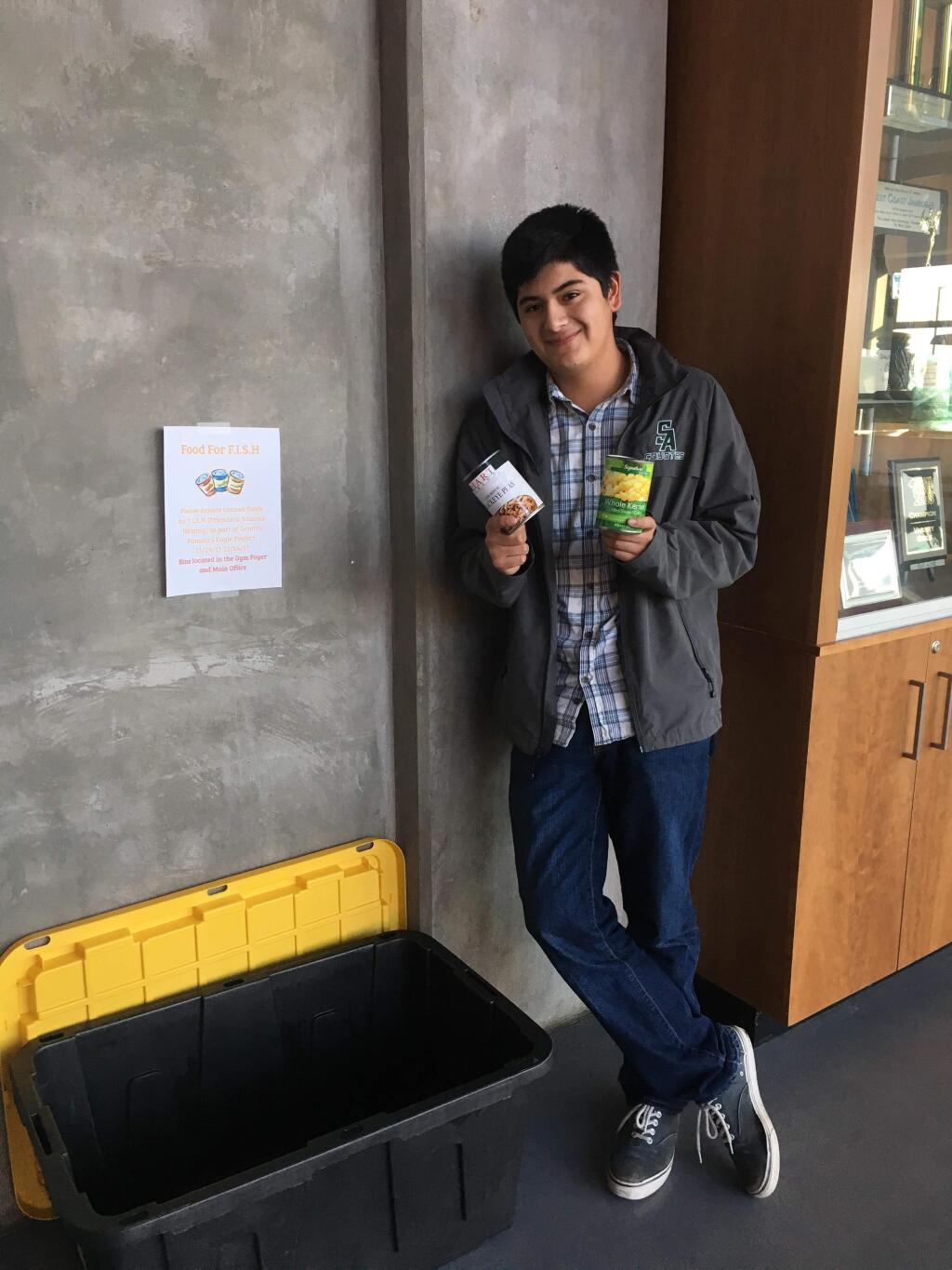 Genaro Pamatz in front of one of his collection bins at Sonoma Academy.