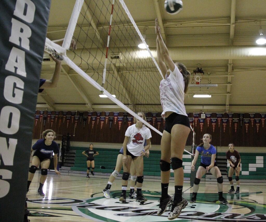 The Lady Dragons volleyball team has been practicing at Pfeiffer Gym for the past two weeks, and showed they're ready for the season with a 3-set sweep of the Analy Tigers in Sebastopol, on Thursday, Aug. 29. First home game is Tuesday, Sept. 3, against Cardinal Newman. (Index-Tribune file photo)