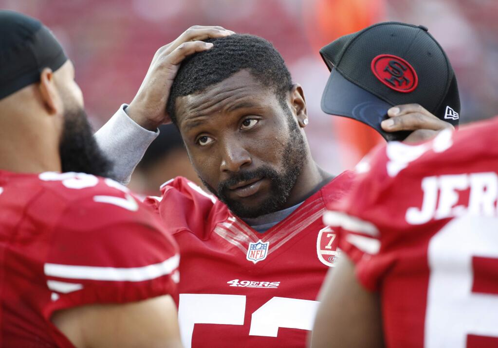 FILE - In this Aug. 14, 2016, file photo, San Francisco 49ers inside linebacker NaVorro Bowman standing on the sidelines during the second half of an NFL preseason football game in Santa Clara, Calif. The 49ers have released Bowman in a move that cut ties with one of the few remaining links from the team's last run of success. (AP Photo/Tony Avelar, File)