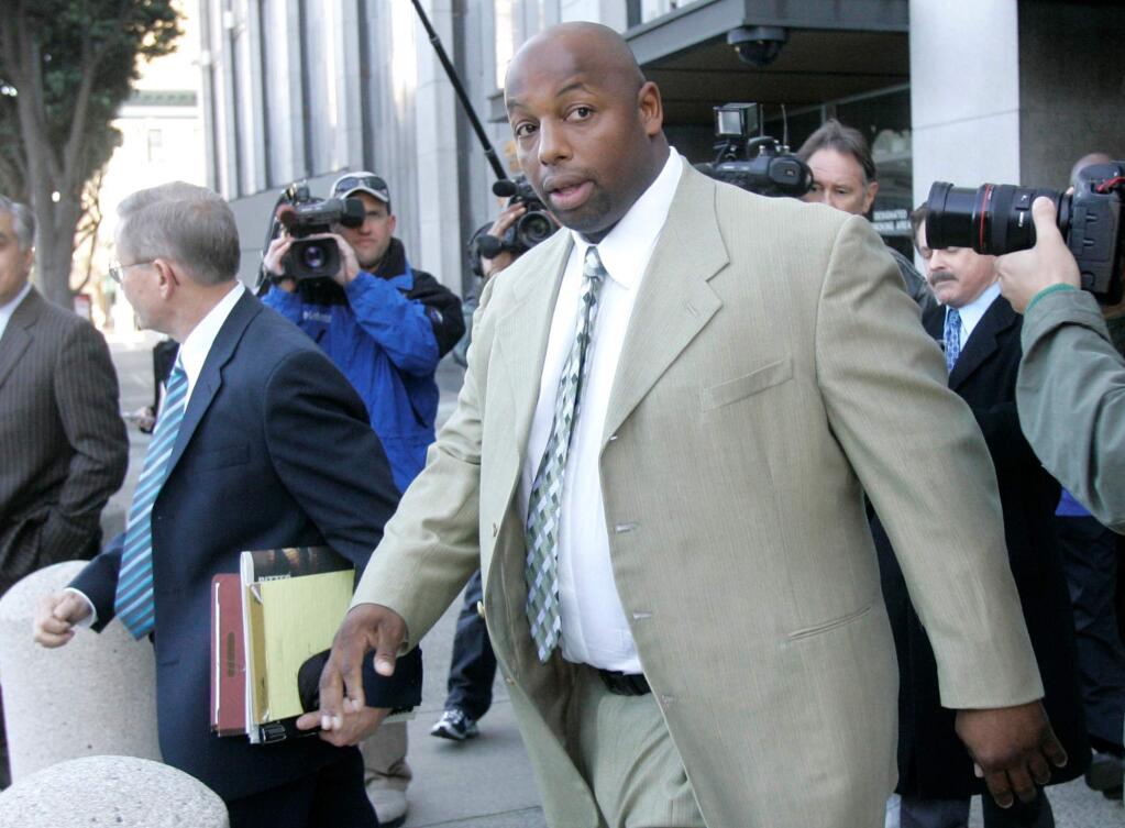 File - In this Jan. 18, 2008 file photo, former NFL football player Dana Stubblefield leaves a federal courthouse in San Francisco. Prosecutors say they have charged former San Francisco 49er Dana Stubblefield with the rape of a 'developmentally delayed' woman. The Santa Clara County District Attorney's Office says the 45-year-old Stubblefield was charged Monday, May 2, 2016, with sexually assaulting the woman last year at his Morgan Hill home. (AP Photo/Jeff Chiu, File)