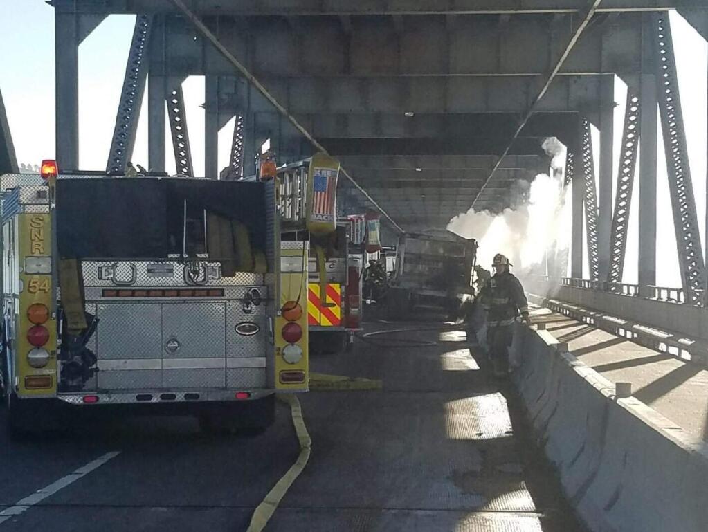 Emergency crews clean up after a big rig crash and fire shut down part of the Richmond-San Rafael Bridge on Tuesday, Sept. 27, 2016. (@CHPMARIN)