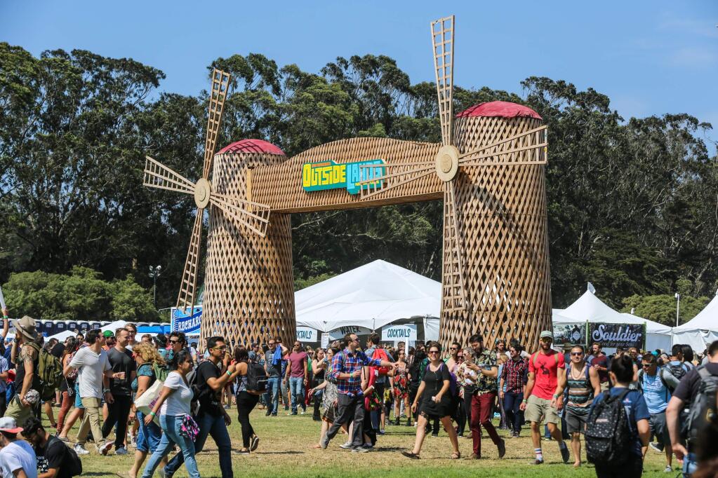 People attend the Outside Lands Music Festival at Golden Gate Park on Friday, Aug. 7, 2015, in San Francisco, Calif. (Rich Fury/Invision/AP)