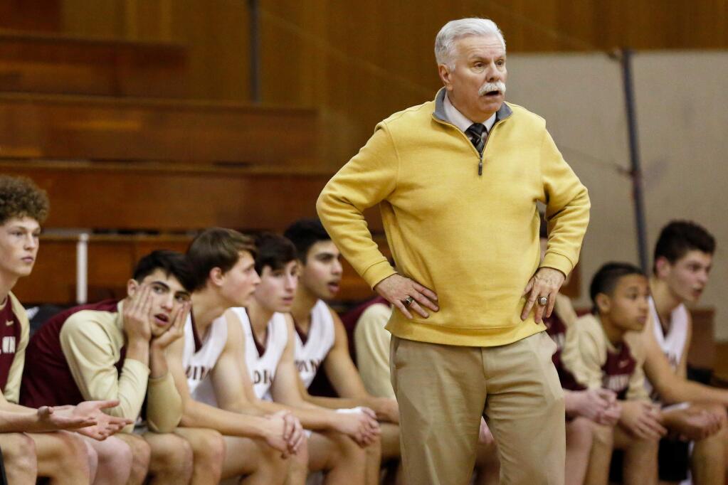 Cardinal Newman head coach Tom Bonfigli reacts to a referee's call during the first half between Drake and Cardinal Newman high schools in the Sonoma County Classic basketball tournament at Piner High School in Santa Rosa on Thursday, Dec. 27, 2018. (Alvin Jornada / The Press Democrat)