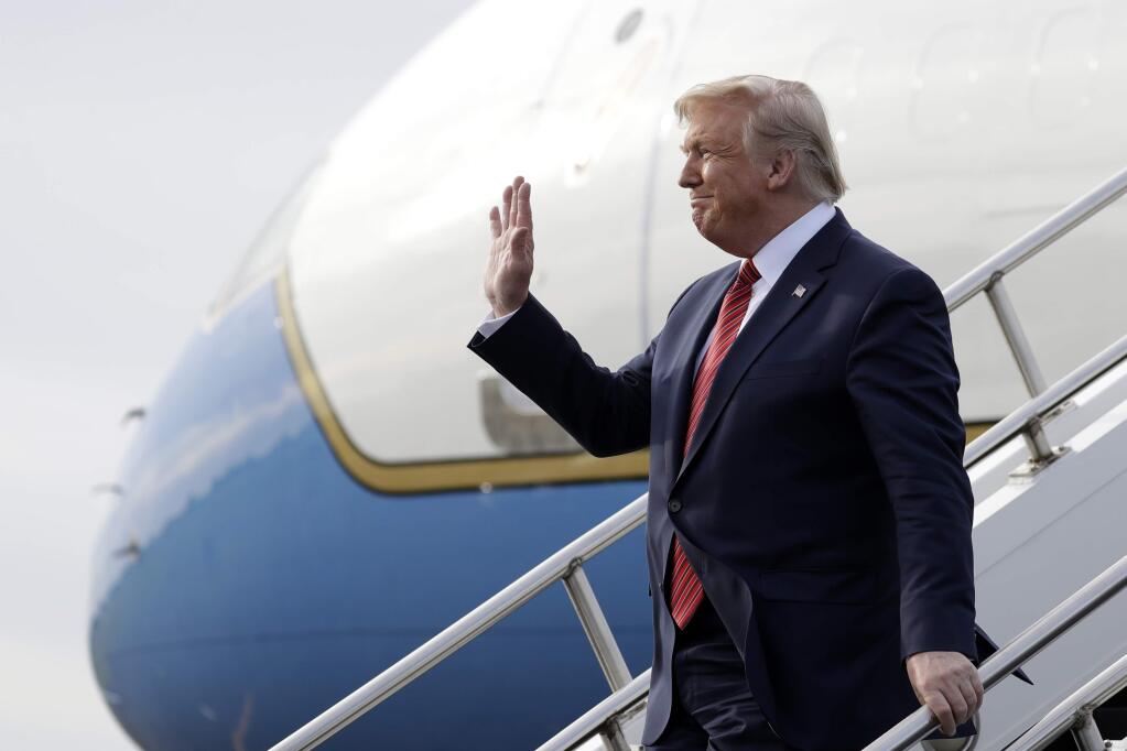 President Donald Trump arrives at Lima Allen Airport to participate in a tour of Pratt Industries with Australian Prime Minister Scott Morrison, Sunday, Sept 22, 2019, in Lima, Ohio. (AP Photo/Evan Vucci)