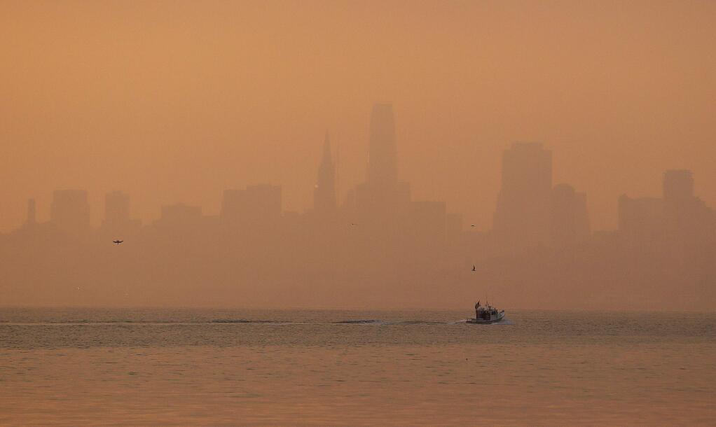 The San Francisco skyline is obscured by smoke and haze from wildfires Thursday, Oct. 12, 2017, in this view from Sausalito, Calif. (AP Photo/Eric Risberg)