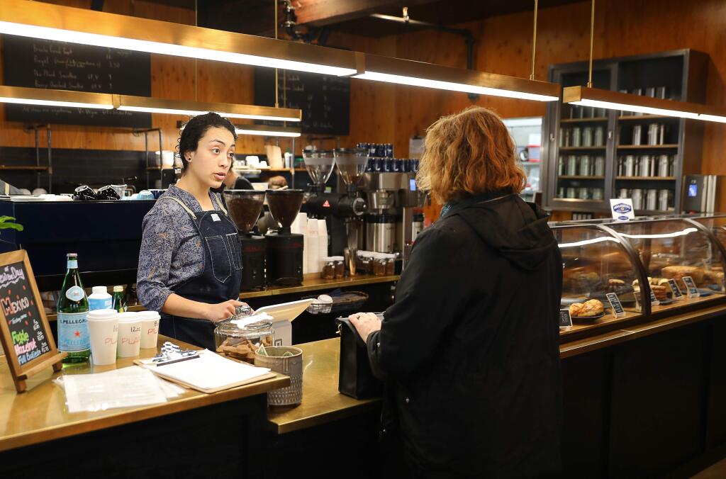 Katia Saldana, left, takes an order from Kathy Loftus at Plank Coffee in Healdsburg on Wednesday, February 27, 2019. (Christopher Chung/ The Press Democrat)