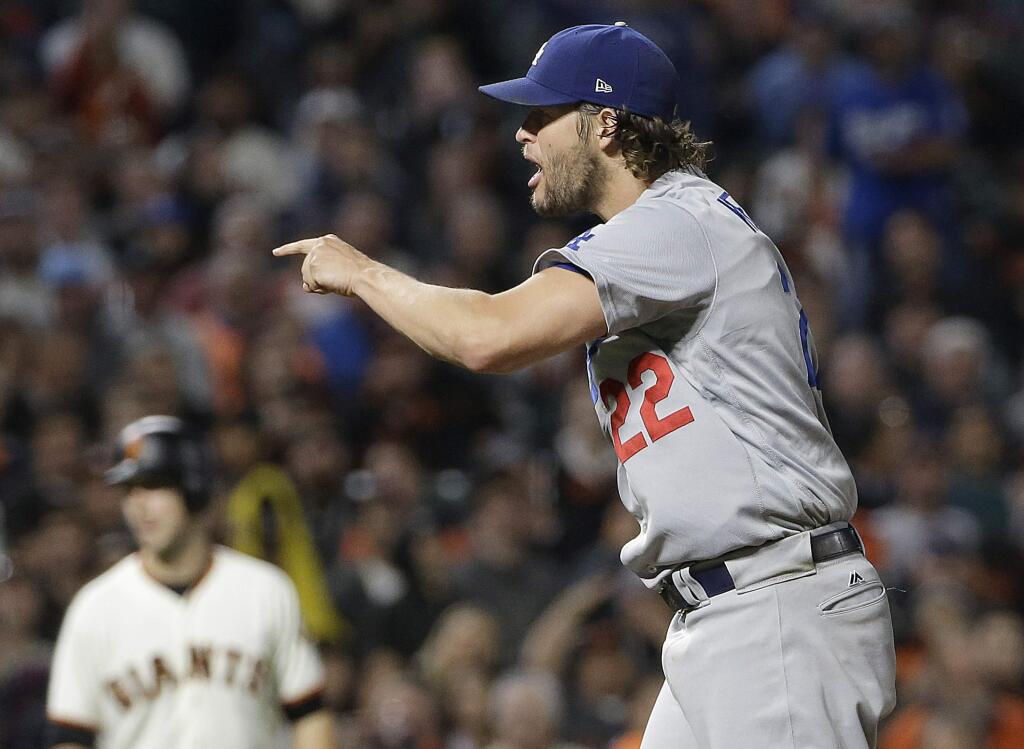 Los Angeles Dodgers pitcher Clayton Kershaw (22) reacts after striking out San Francisco Giants' Tim Federowicz to end the seventh inning in San Francisco, Tuesday, Sept. 12, 2017. (AP Photo/Jeff Chiu)