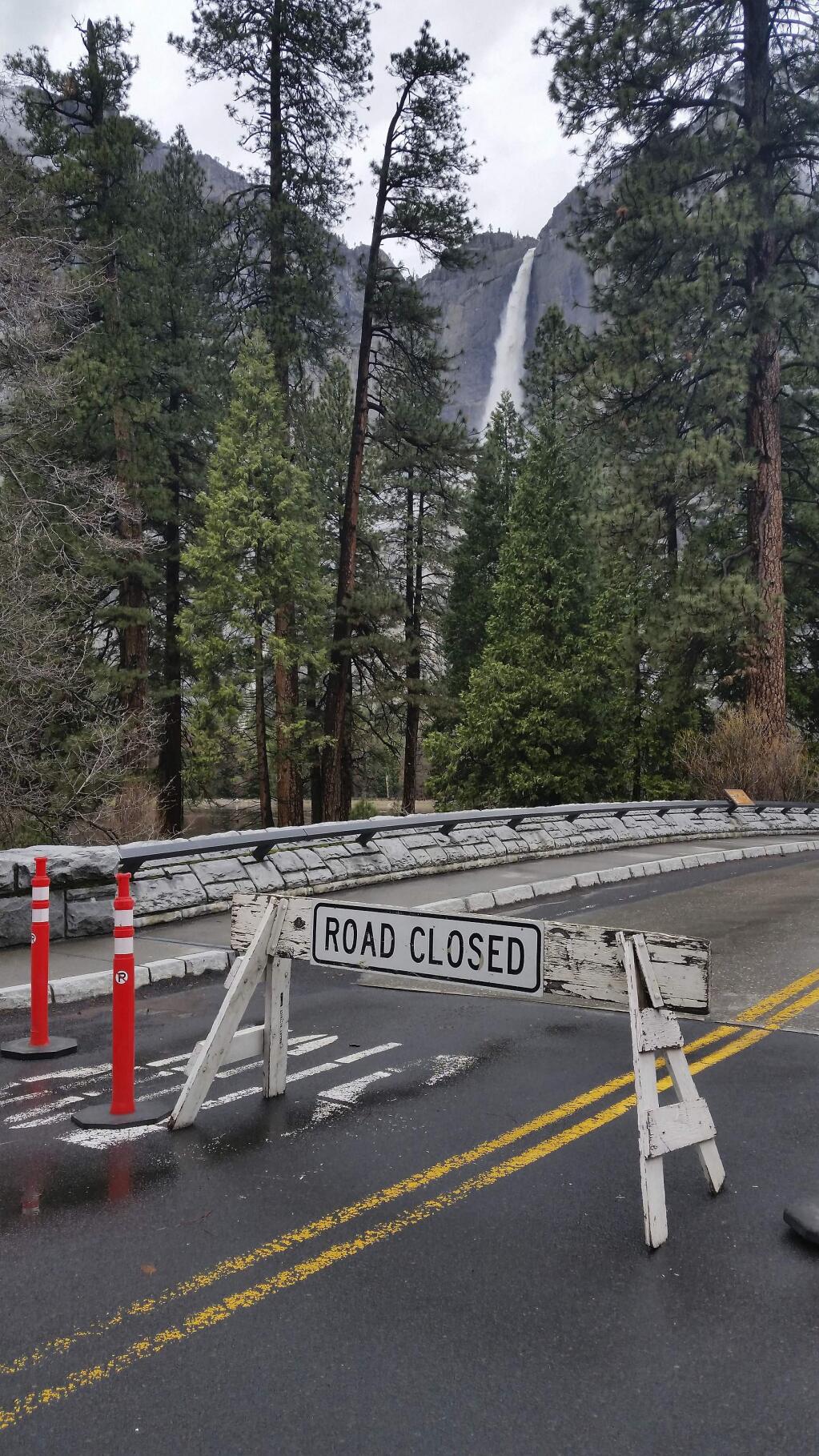 In this Saturday, April 7, 2018, photo released by the National Park Service, roads in Yosemite Valley have been impacted by high water in Yosemite, Calif. Sections of Northside Drive, Southside Drive, and Sentinel Drive remain closed due to high water in the roadway. Parts of Yosemite National Park remained closed as the Merced River peaked several feet above flood stage through the Yosemite Valley. (National Park Service via AP)