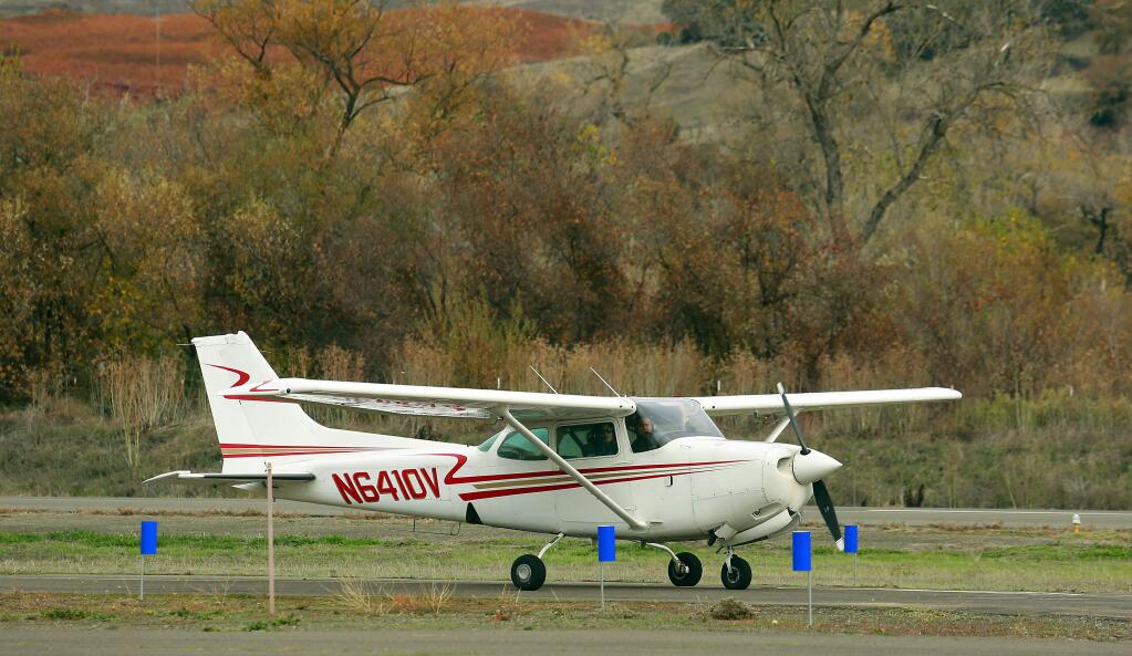 A pilot lands at the Cloverdale airport on Saturday. (JOHN BURGESS / The Press Democrat)