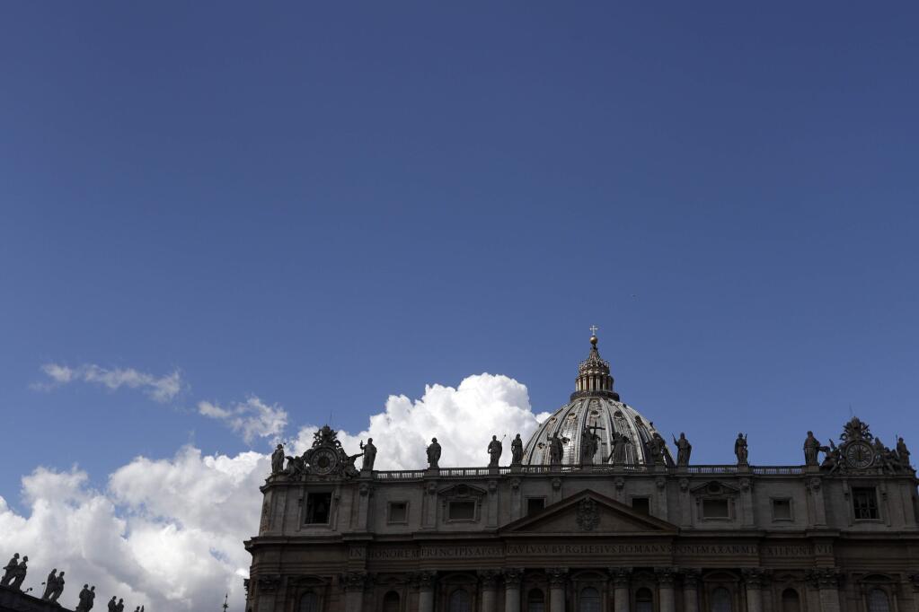 Clouds pass over St. Peter's Basilica prior to the start of Pope Francis' Angelus noon prayer at the Vatican, Sunday, Sept. 3, 2017. (AP Photo/Gregorio Borgia)