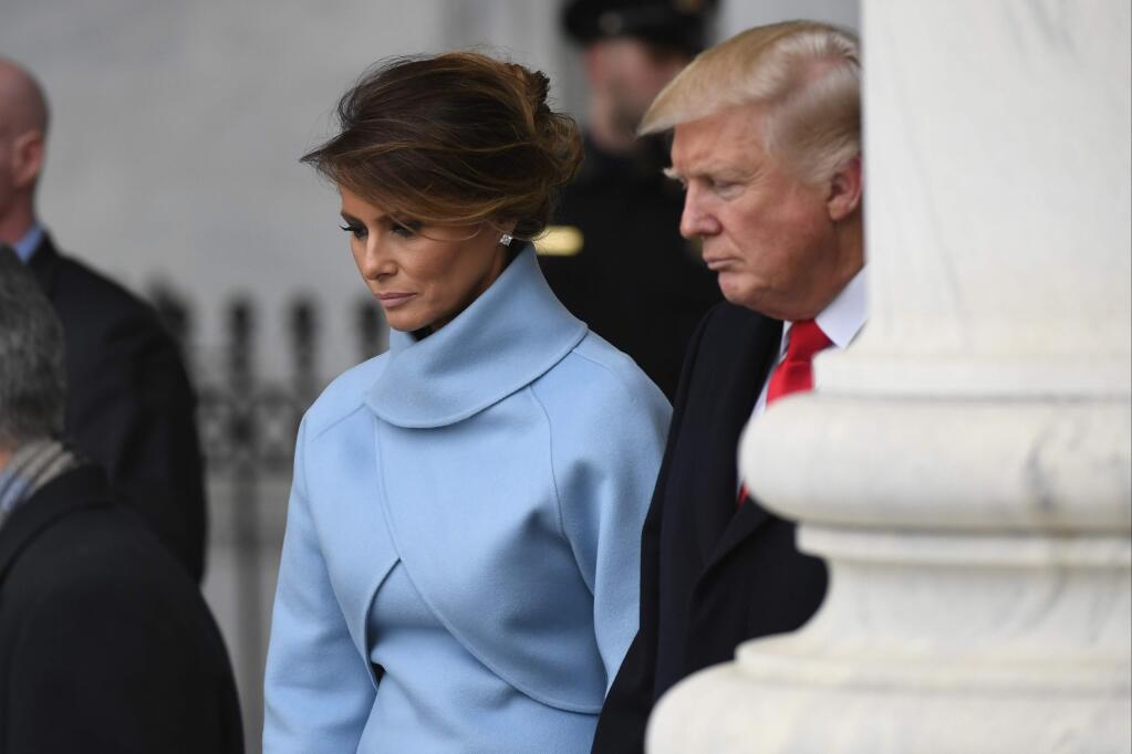 President Donald Trump and first lady Melania Trump depart the Capitol during the 2017 Presidential Inauguration at the U.S. Capitol Friday, Jan. 20, 2017, in Washington. (Jack Gruber/Pool Photo via AP)