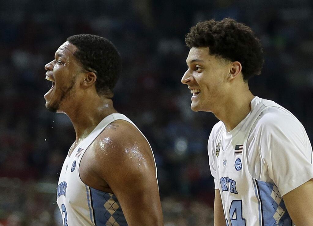 North Carolina's Kennedy Meeks, left, and Justin Jackson react during the second half in the NCAA tournament against Oregon, Saturday, April 1, 2017, in Glendale, Ariz. (AP Photo/David J. Phillip)