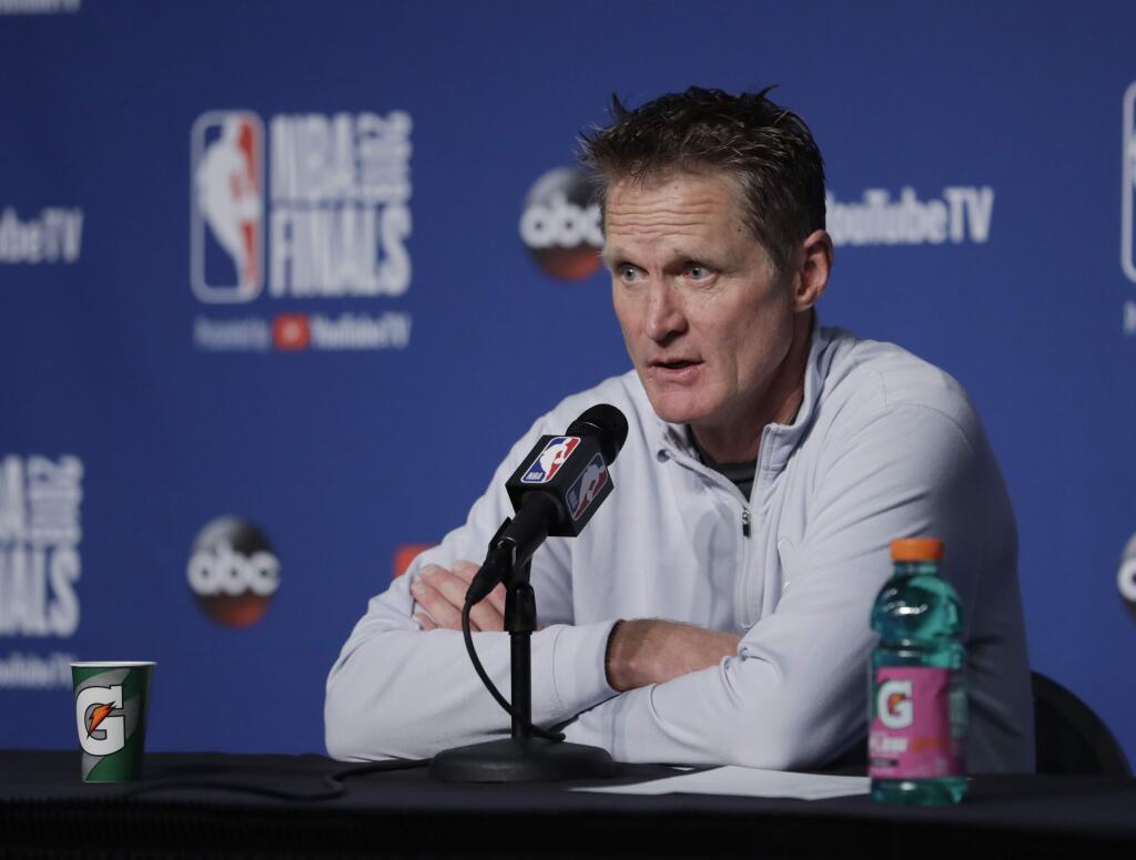 Golden State Warriors coach Steve Kerr speaks to reporters after the Warriors defeated the Cleveland Cavaliers 108-85 in Game 4 of basketball's NBA Finals to win the NBA championship, early Saturday, June 9, 2018, in Cleveland. (AP Photo/Tony Dejak)