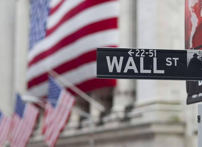 In this Aug. 8. 2011 photo, a Wall Street sign hangs near the New York Stock Exchange, in New York. City officials could tie Santa Rosa’s finances closer to global markets by taking on pension obligation bonds to confront debt. (AP Photo/Jin Lee)