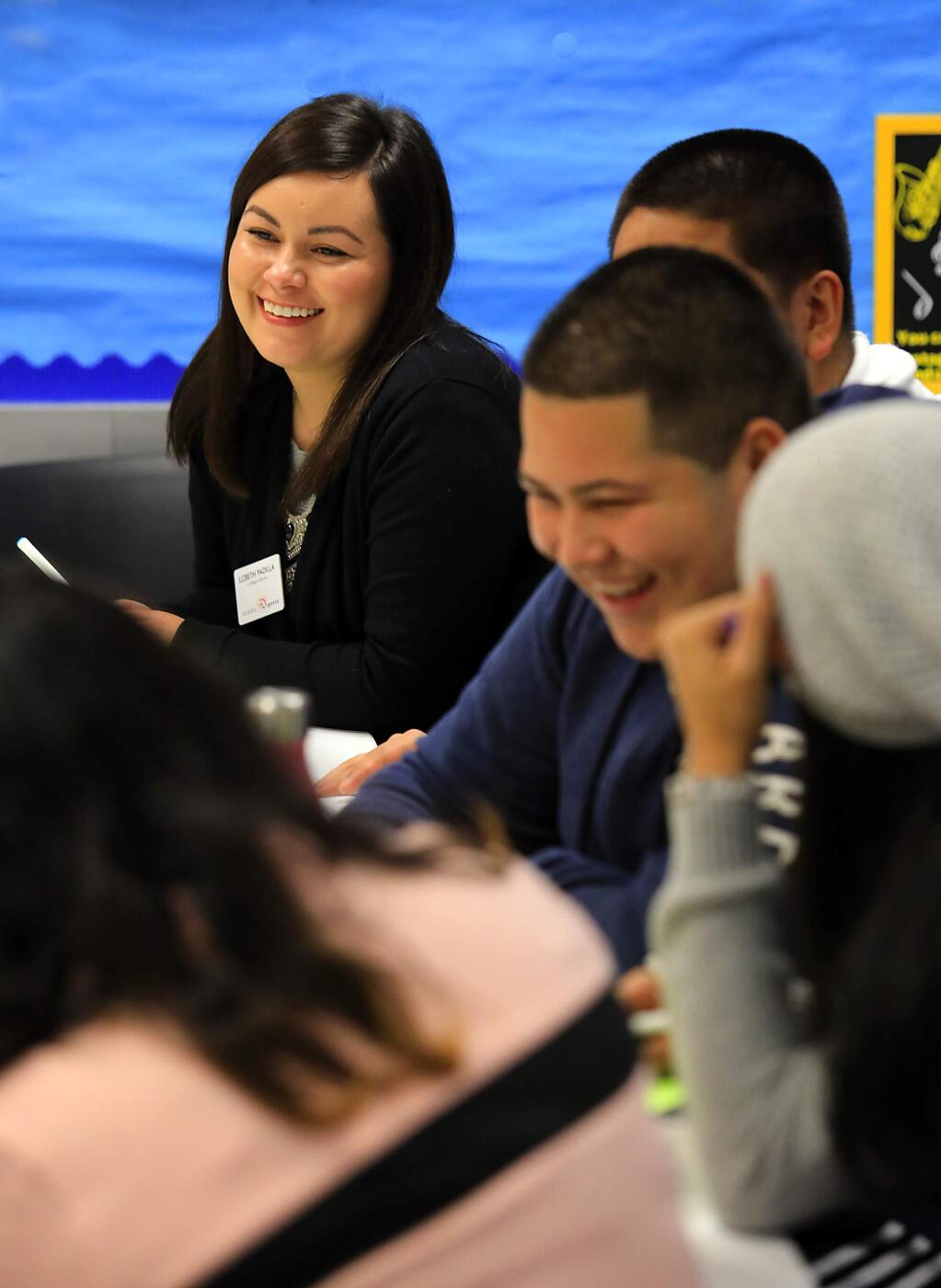 10,000 Degrees College Advisor Lizbeth Padilla conducts a meeting on career choices with juniors at Elsie Allen High School in Santa Rosa. (John Burgess/The Press Democrat)