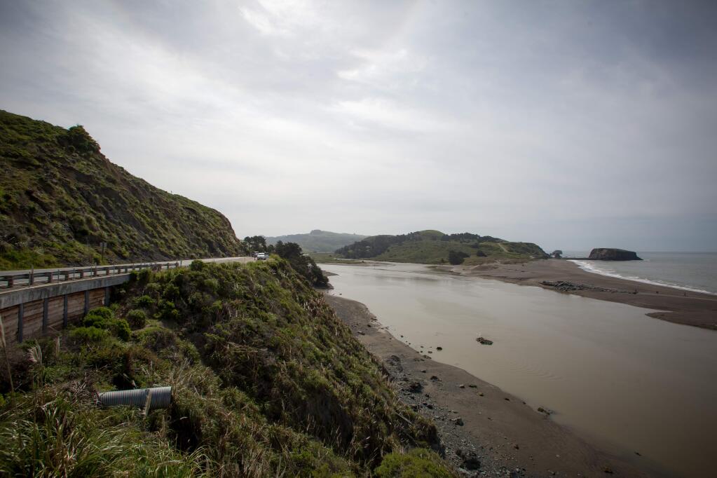 Water flows down an estuary in Jenner, Calif. near the ocean and Highway 1 Saturday, April 15, 2017. Jenner is one of the locations in Sonoma County most vulnerable to sea level rise. A new report suggests a 6-foot rise in sea waters possible by the year 2100, would completely cover Highway 1. (Jeremy Portje / For The Press Democrat)