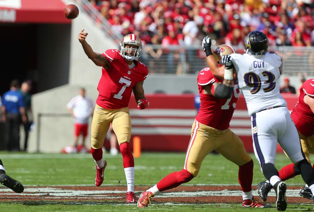 San Francisco 49ers quarterback Colin Kaepernick throws a pass against the Baltimore Ravens during their game in Santa Clara on Sunday, Oct. 18, 2015. (Christopher Chung / The Press Democrat)