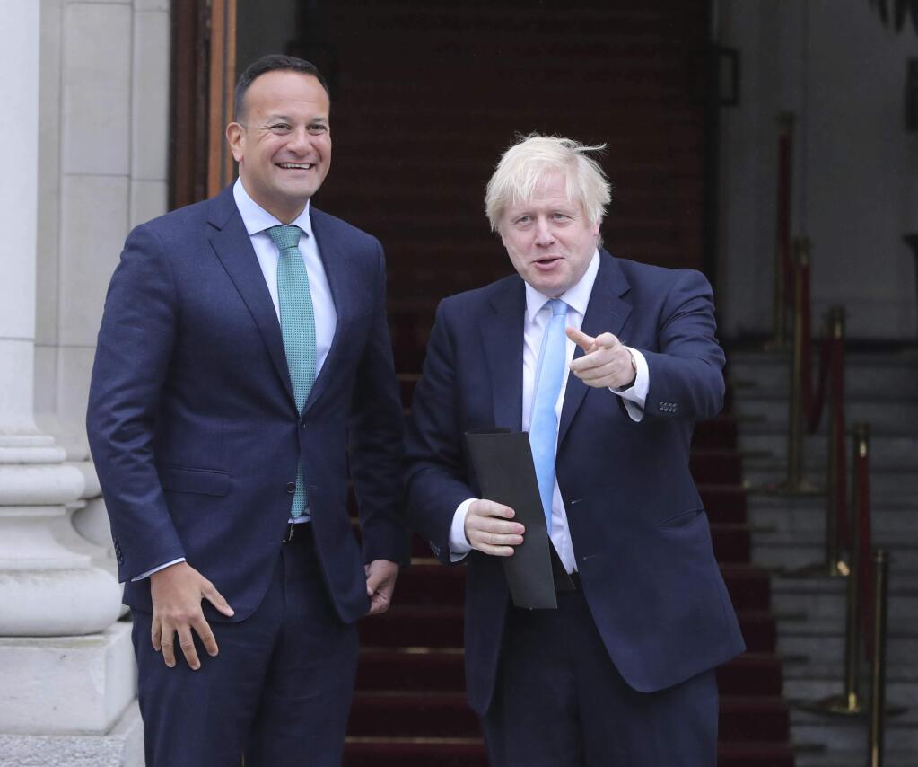Britain's Prime Minister Boris Johnson, right, is welcomed by Ireland's Prime Minister Leo Varadkar at Government Buildings in Dublin, Monday Sept. 9, 2019. Boris Johnson is to meet with Leo Varadkar in search of a compromise on the simmering Brexit crisis. (Niall Carson/PA via AP)