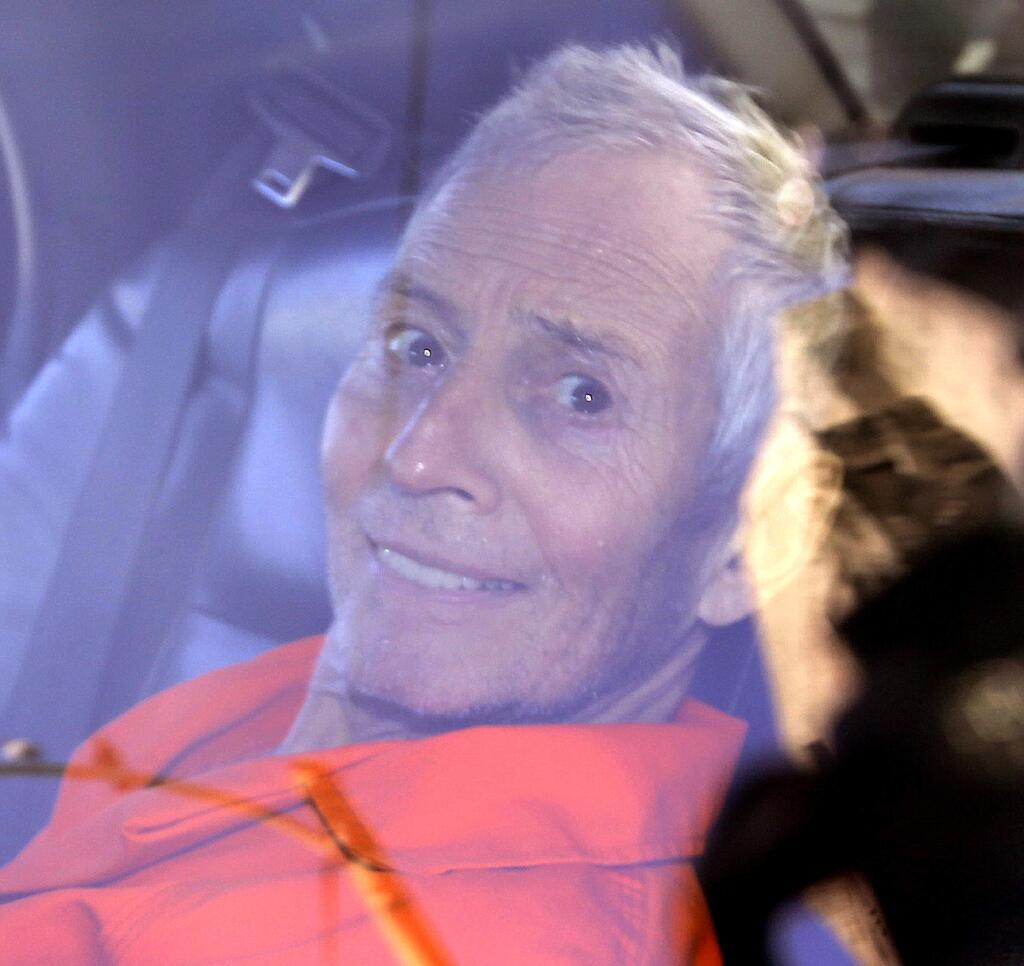 FILE - In this Tuesday, March 17, 2015 file, Millionaire Robert Durst is escorted from Orleans Parish Criminal District Court to the Orleans Parish Prison after his arraignment in New Orleans. Durst is going back to court in New Orleans after nearly a week in a prison mental ward 70 miles away. At a preliminary hearing on weapons charges on Monday, March 23, his lawyers planned to argue that the 71-year-old Houston man should be released because he was illegally arrested on those charges and a Los Angeles County warrant accusing him of murdering a female friend. (AP Photo/Gerald Herbert, File)