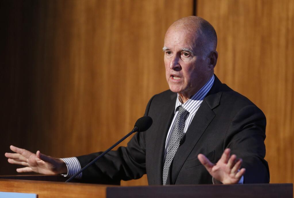 FILE - In this Oct. 27, 2015 file photo, California Gov. Jerry Brown speaks at the Carbon Neutrality Initiative on the campus of the University of California-San Diego, in San Diego. California lawmakers moved closer to extending the state's ambitious climate change law Tuesday, Aug. 23, 2016, after winning critical approval from business-minded Democratic lawmakers in the state Assembly with encouragement from the White House. Extending California's greenhouse-gas reduction plan is critical to the legacy of Brown, who has put climate change at the forefront of his priorities and touted the state's moves at the Vatican, at a climate summit in Paris and at the Democratic National Convention this summer. (AP Photo/Lenny Ignelzi, File)
