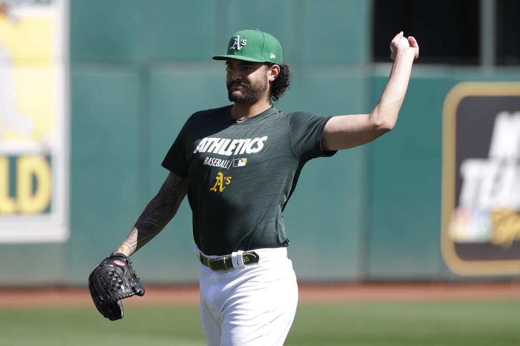Oakland Athletics pitcher Sean Manaea throws during practice in Oakland, Tuesday, Oct. 1, 2019. The Athletics are scheduled to face the Tampa Bay Rays in an American League wild-card game Wednesday, Oct. 2. (AP Photo/Jeff Chiu)