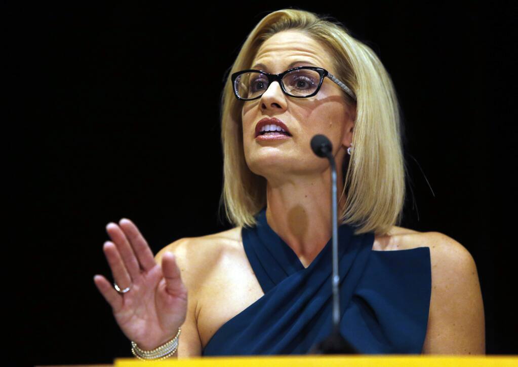 U.S. Sen.-elect Kyrsten Sinema, D-Ariz., speaks after being declared the winner over Republican challenger U.S. Rep. Martha McSally, Monday, Nov. 12, 2018, in Scottsdale, Ariz. Sinema won Arizona's open U.S. Senate seat in a race that was among the most closely watched in the nation, beating McSally in the battle to replace GOP Sen. Jeff Flake. (AP Photo/Rick Scuteri)