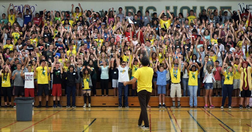 Casa Grande's Paul Koene rallies incoming freshmen during a first-ever Link Crew orientation event on Thursday, August 13, 2015. (ERIC GNECKOW/ARGUS-COURIER STAFF)