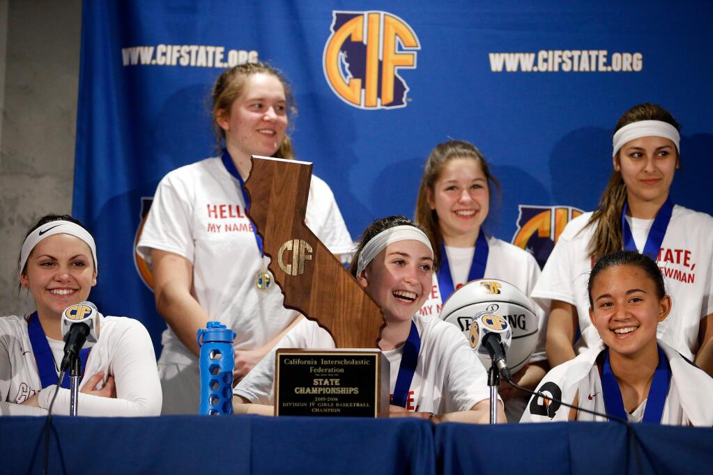 Cardinal NewmanÕs Maiya Flores, left, Taylor Hextrum, Hailey Vice-Neat, Elena Aldridge, Avery Cargill, and Ava Alvarez at the postgame press conference after the Cardinals defeated Antelope Valley with a score of 39-37 in the CIF Division IV girls basketball championship game between Cardinal Newman and Antelope Valley high schools at Sleep Train Arena in Sacramento, California, on Saturday, March 26, 2016. (Alvin Jornada / The Press Democrat)