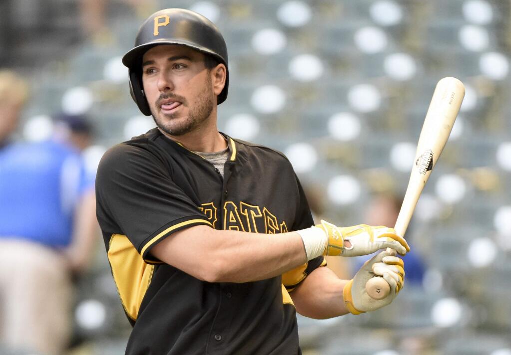 In this Aug. 25, 2016, file photo, the Pittsburgh Pirates' Matt Joyce warms up before a game against the Milwaukee Brewers in Milwaukee. The Oakland Athletics have found their potential new right fielder, agreeing to terms with Joyce on an $11 million, two-year contract Wednesday, Nov. 30, 2016. (AP Photo/Benny Sieu, File)