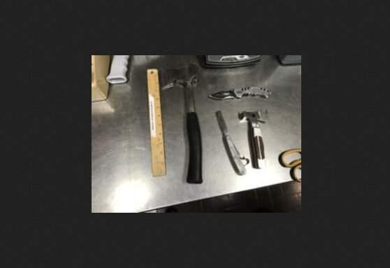 The hatchet, knife and other items police found on a man who bicycled into a Santa Rosa police parking lot on Wednesday, Dec. 5, 2018. (SANTA ROSA POLICE DEPARTMENT)