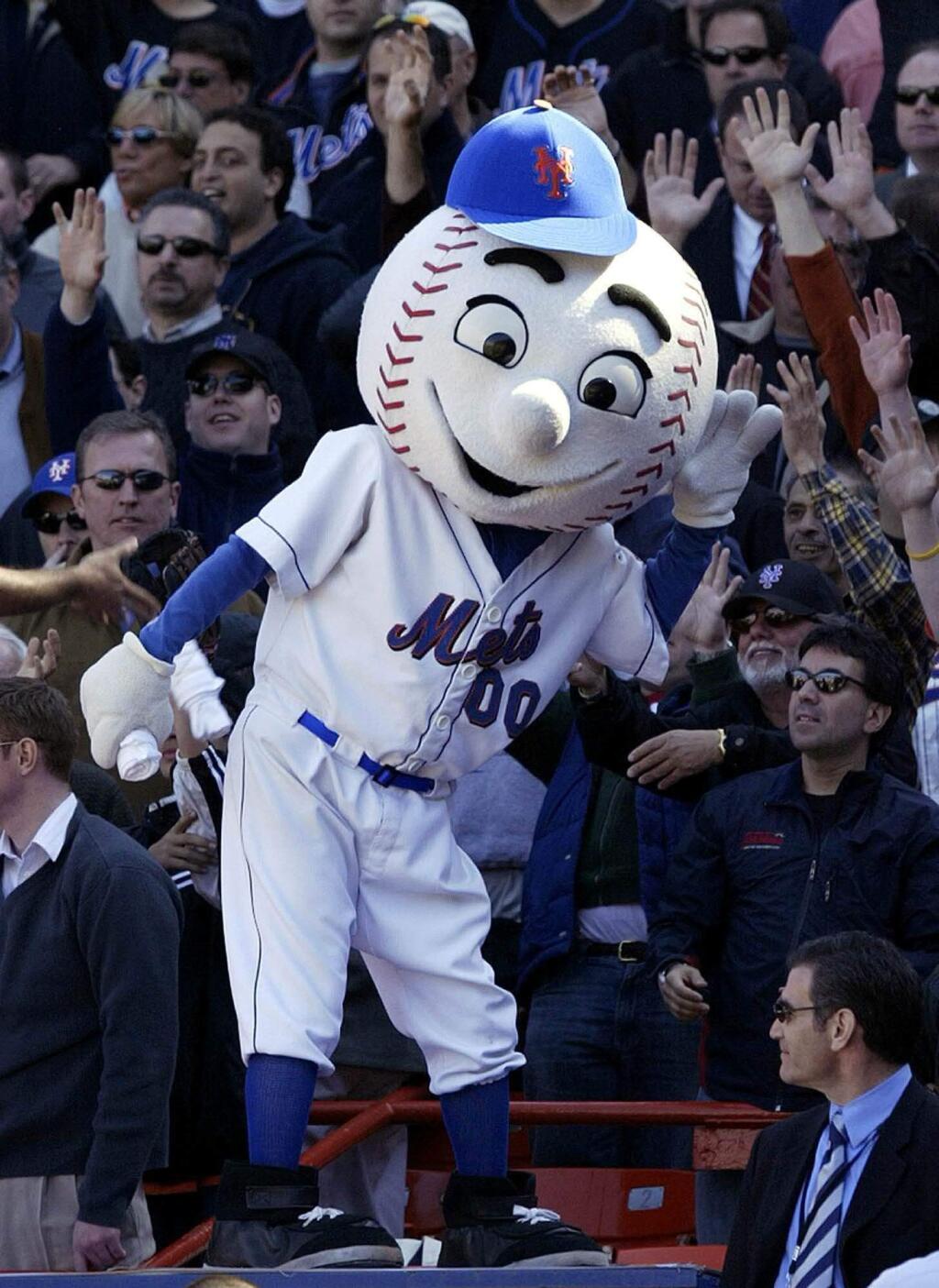 FILE - In this April 11, 2005, file photo, New York Mets mascot Mr. Met reacts with the crowd during the Mets home opener against the Houston Astros at Shea Stadium in New York. Even Mr. Met is frustrated with the team's start. New York's beloved mascot flashed an upraised middle finger at a fan during Wednesday night's, May 31, 2017, 7-1 loss to the Milwaukee Brewers, and the employee will not work for the Mets again. A Mets official told The Associated Press more than one person wears the Mr. Met costume during each season, and the person who donned it Wednesday night will not do so again. The Mets official spoke on condition of anonymity because the statement from the organization was the team's only authorized comment. (AP Photo/Gregory Bull, File)