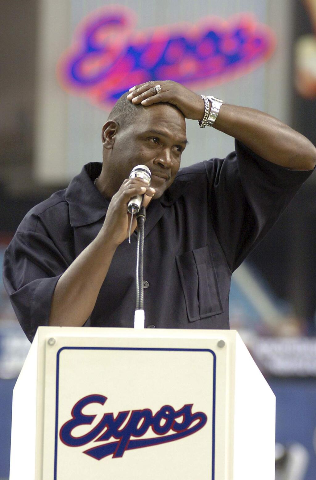 FILE - In this June 19, 2004, file photo, former Montreal Expos baseball player Tim Raines gets emotional when giving a speech to the crowd after the Montreal Expos retired his number 30 during a ceremony at the Olympic Stadium, in Montreal. Raines and Jeff Bagwell are likely to be voted into baseball's Hall of Fame on Wednesday, Jan. 18, 2017, when Trevor Hoffman and Ivan Rodriguez also could gain the honor. (Francois Roy/The Canadian press via AP, File)