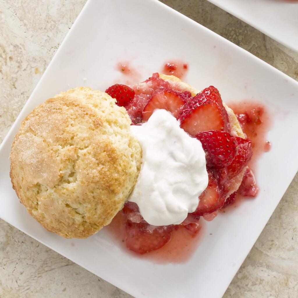 This undated photo provided by America's Test Kitchen in June 2018 shows strawberry shortcakes in Brookline, Mass. This recipe appears in the cookbook ‚ÄúJust Add Sauce.‚Äù (Daniel J. van Ackere/America's Test Kitchen via AP)