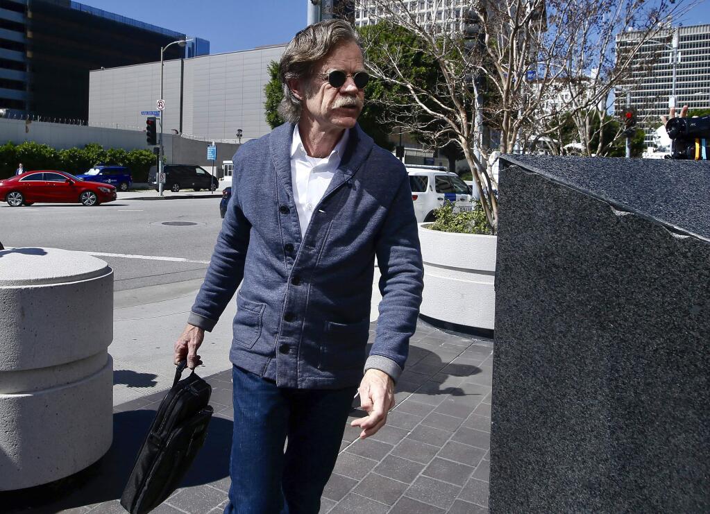 Actor William H. Macy arrives at the federal courthouse in Los Angeles, on Tuesday, March 12, 2019. Macy's wife, actress Felicity Huffman is among 50 people who were charged Tuesday in a scheme in which wealthy parents allegedly bribed college coaches and other insiders to get their children into some of the nation's most elite schools. (AP Photo/Alex Gallardo)