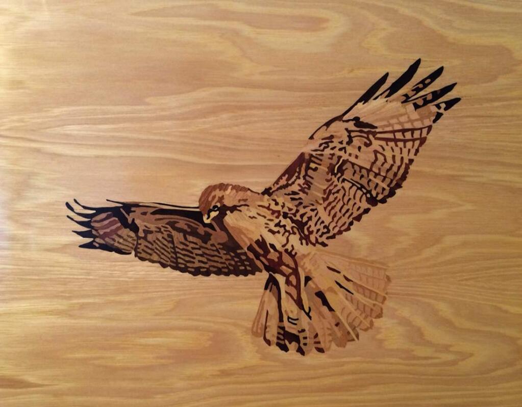 This is an example of BillTaft's marquetry, which is the process of cutting and assembling a variety of thin pieces of different woods.