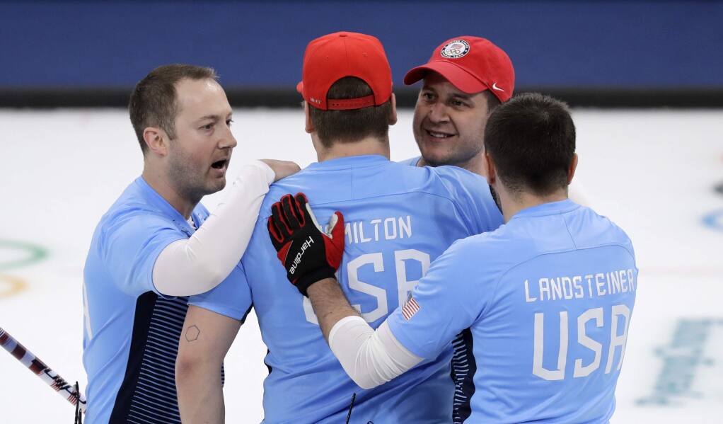 The United States team celebrates after defeating Canada during the men's curling semifinal match at the 2018 Winter Olympics in Gangneung, South Korea, Thursday, Feb. 22, 2018. (AP Photo/Aaron Favila)