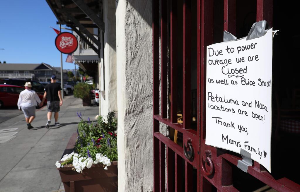 A sign at Mary's Pizza Shack in downtown Sonoma informs customers of their closure due to the PG&E power shutdown on Wednesday, October 9, 2019. (Christopher Chung/ The Press Democrat)