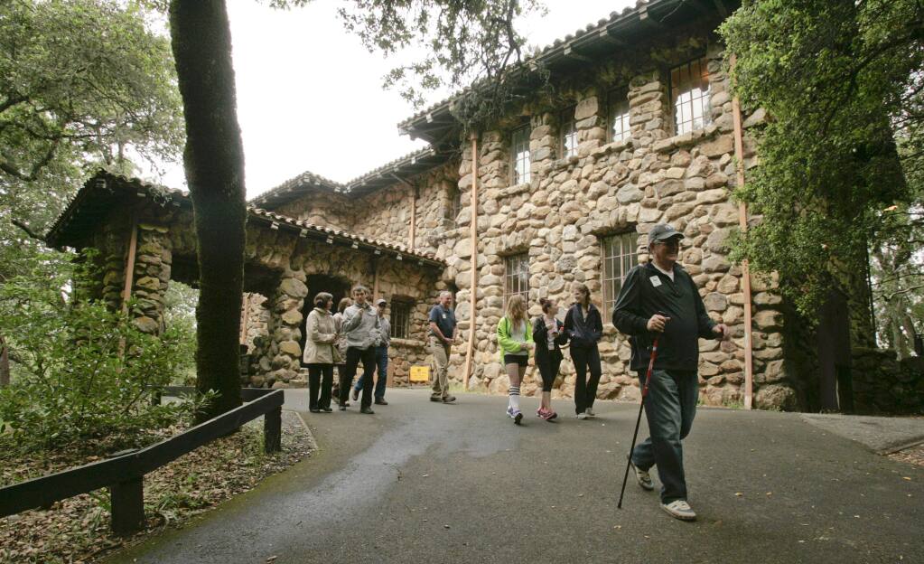 Volunteer Bern Lefson leads a group in front of the House of Happy Walls, built by Charmian London, at the start of a hiking tour at Jack London State Historic Park in 2013. (Scott Manchester / The Press Democrat file)