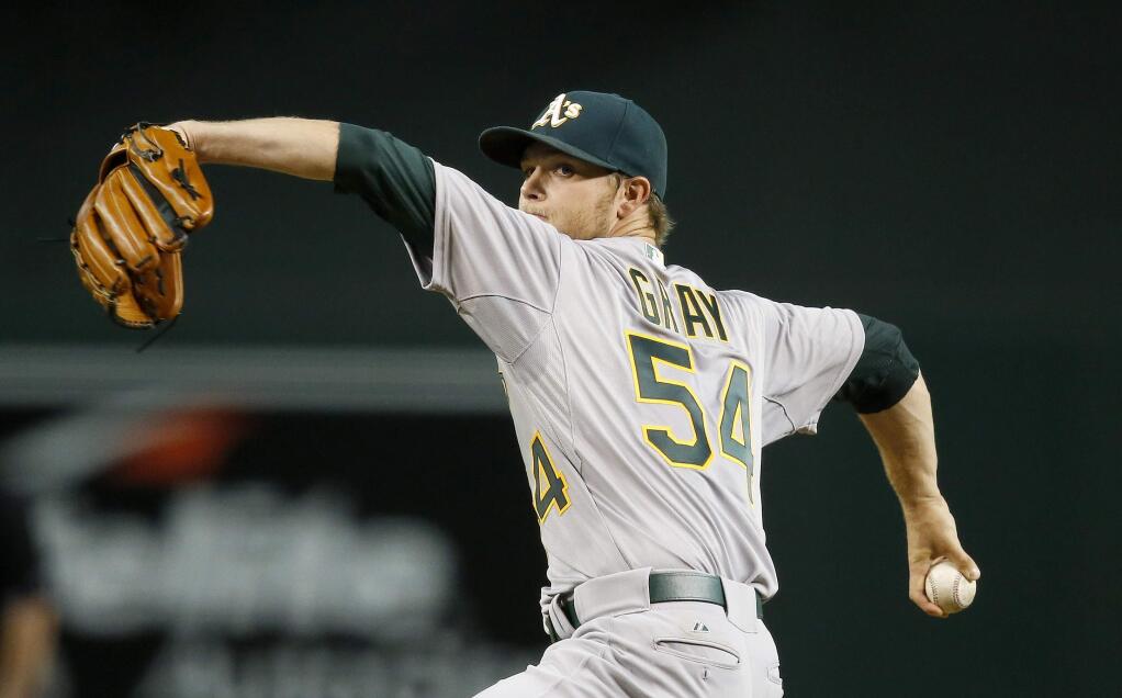 Oakland Athletics' Sonny Gray throws a pitch against the Arizona Diamondbacks during the first inning of a game Friday, Aug. 28, 2015, in Phoenix. (AP Photo/Ross D. Franklin)