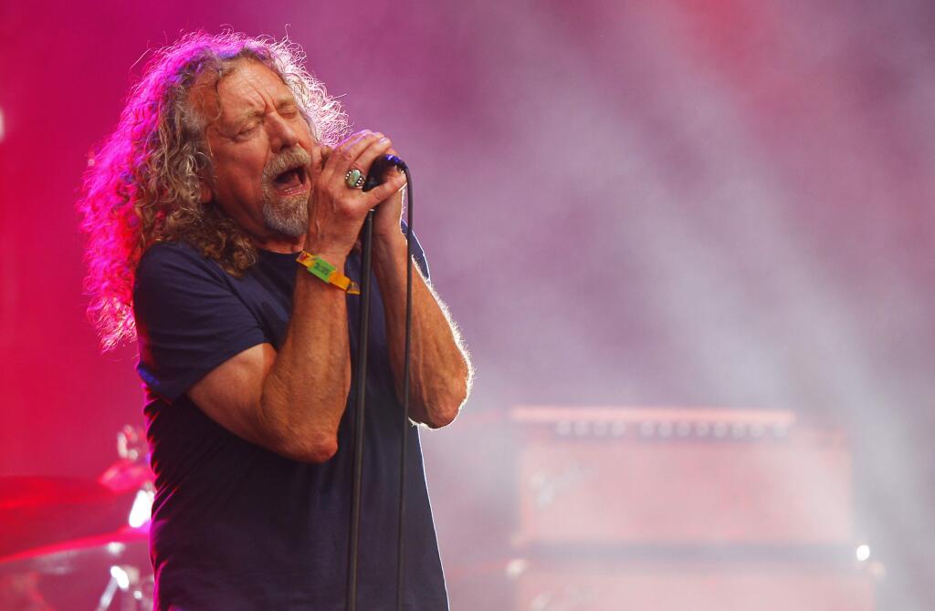 FILE - In this June 14, 2015, file photo, Robert Plant and The Sensational Space Shifters perform at the Bonnaroo Music and Arts Festival in Manchester, Tenn. Plant announced his 2018 North American tour on Sept. 26, 2017. (Photo by Wade Payne/Invision/AP, File)