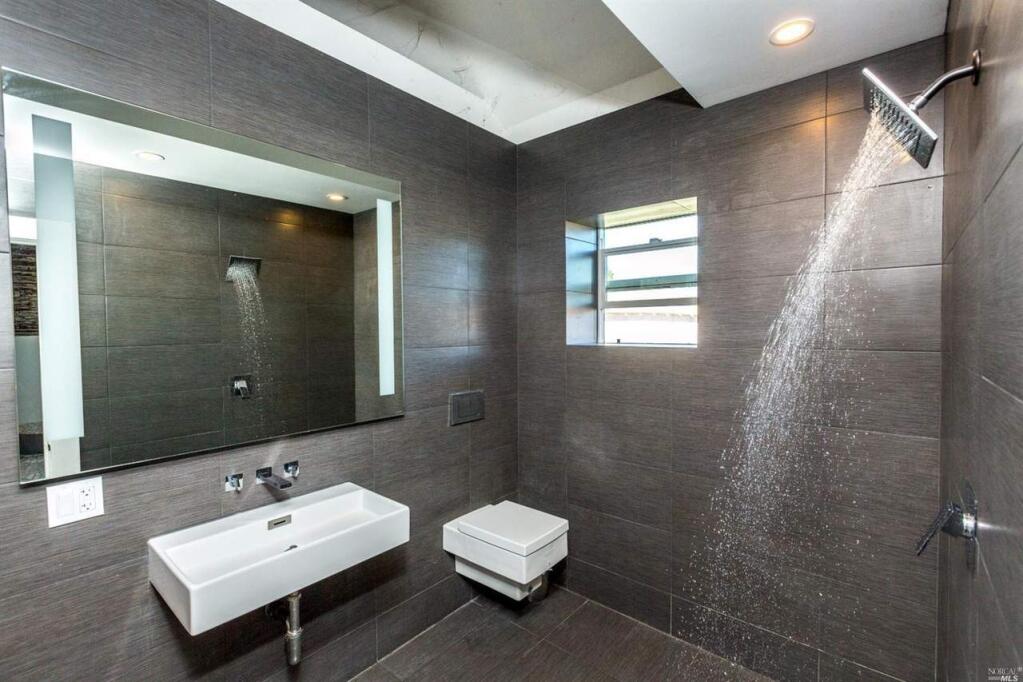 A sleek modern bathroom with slate grey tiles at 3150 Pepper Road, Petaluma. Property listed by Sean Payne/ Pacific Union International, pacificunion.com, 707.206.2004. (Courtesy of BAREIS)