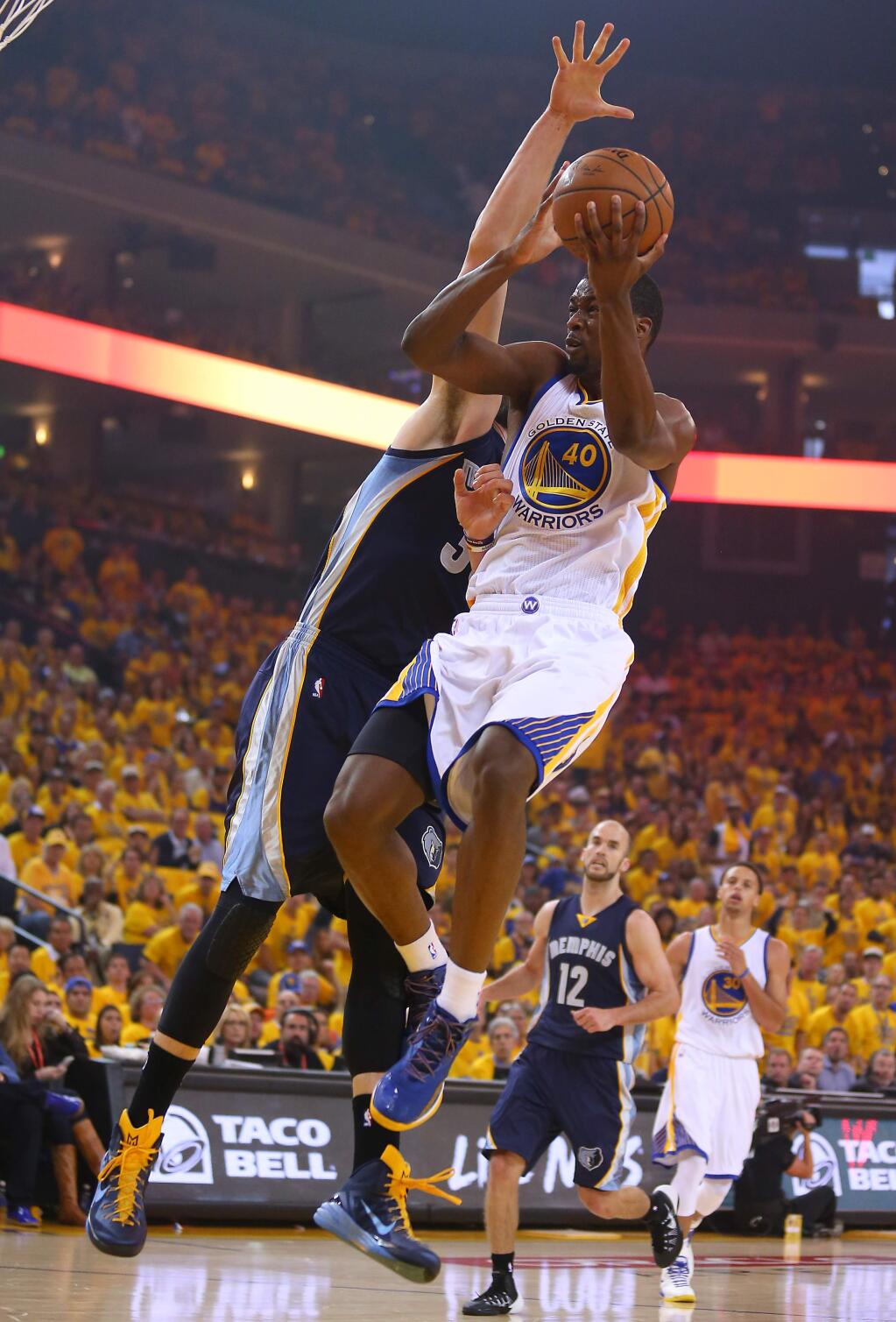 Golden State Warriors forward Harrison Barnes goes up for a shot against Memphis Grizzlies center Marc Gasol during Game 1 of the NBA Playoffs Western Conference Semifinals at Oracle Arena, in Oakland on Sunday, May 3, 2015. (Christopher Chung/ The Press Democrat)