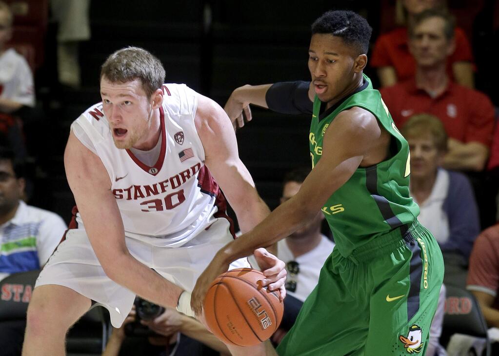 Oregon's Kendall Small, right, tries to take the ball from Stanford's Grant Verhoeven (30) during the first half in Stanford, Saturday, Feb. 13, 2016. (AP Photo/Jeff Chiu)