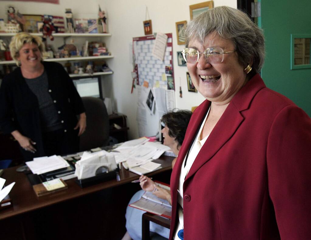 Eeve Lewis, right, Sonoma County clerk, assessor and recorder, jokes with Janice Atkinson, left, assistant registrar of voters, and Elizabeth Acosta, election manager in 2005. (PD FILE)