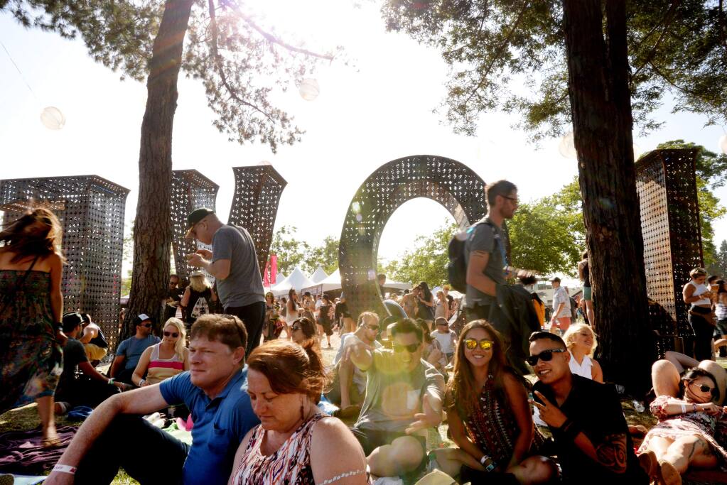 Attendees chilling behind the LOVE sculpture at BottleRock music festival in Napa, California, Sunday, May 29, 2016.(Photo: Erik Castro/for The Press Democrat)