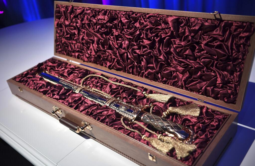 A Korean sword presented by Russian President Vladimir Putin to North Korea's leader Kim Jong Un is on display during their meeting in Vladivostok, Russia, Thursday, April 25, 2019. Russian President Vladimir Putin and North Korean leader Kim Jong Un say they have had fruitful talks about how to defuse a standoff over Pyongyang's nuclear program. (Alexei Nikolsky, Sputnik, Kremlin Pool Photo via AP)